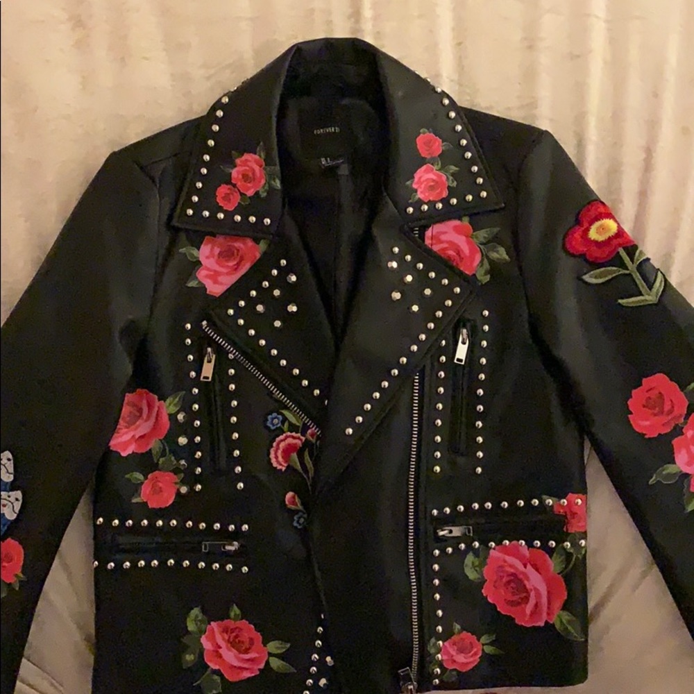 Vegan leatherette jacket with embellishments.